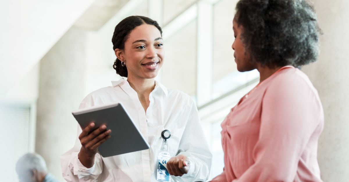 An Occupational Therapist having a conversation with a patient