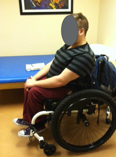 A male client seated in a wheelchair as an example of a client with sensory issues