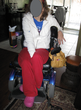 An adult woman seated in a wheelchair as another example of a seated posture