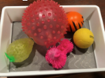 Textured balls in a bin