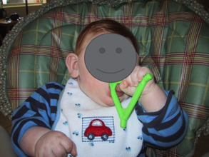 Baby gnawing on teething toy