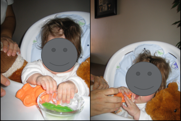 Baby using touch to investigate things on tray