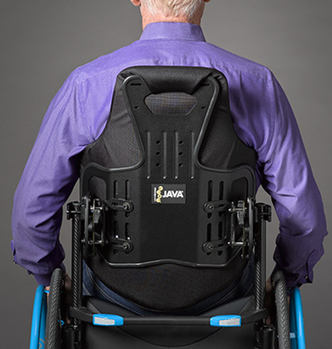 A contoured wheelchair back that goes to top of the shoulders