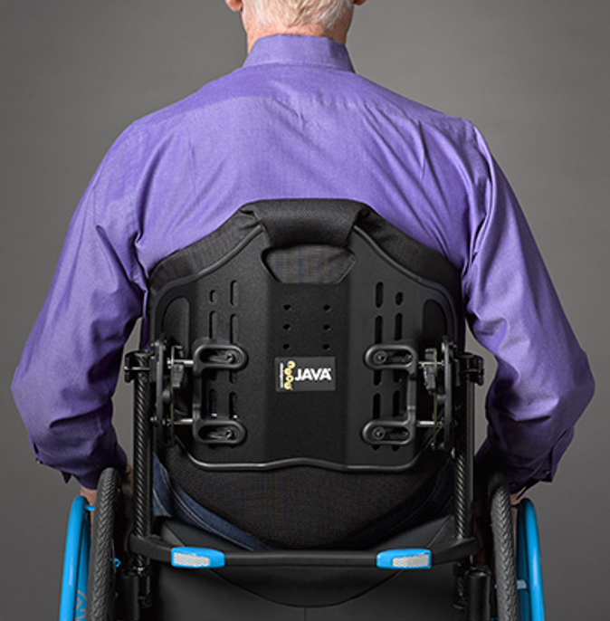 A contoured wheelchair back that goes to the mid-scapula, upper thoracic area of the back