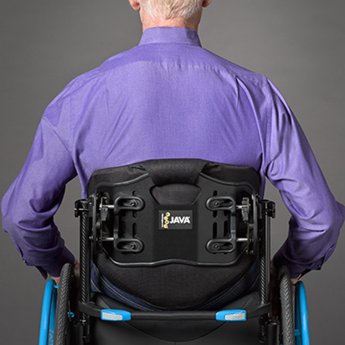 A contoured wheelchair back that goes below the scapula